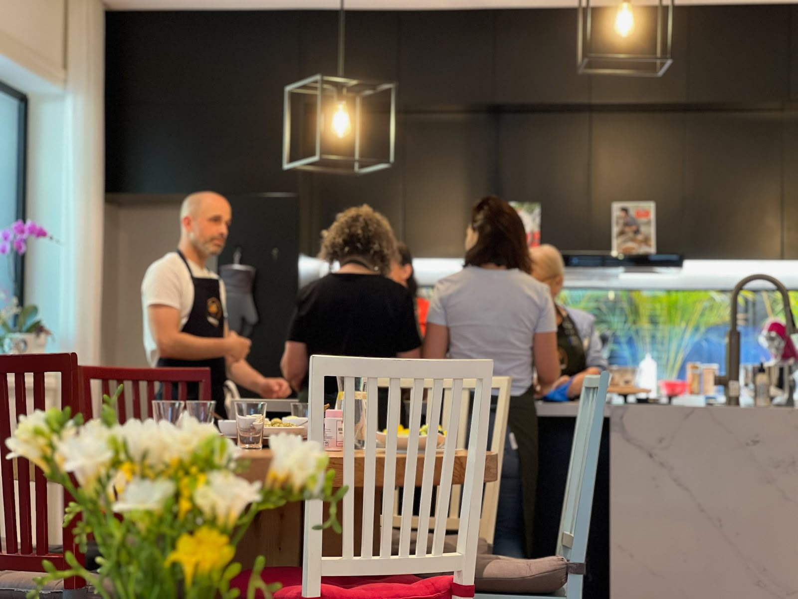 Roy guiding participants through a hands-on baking workshop